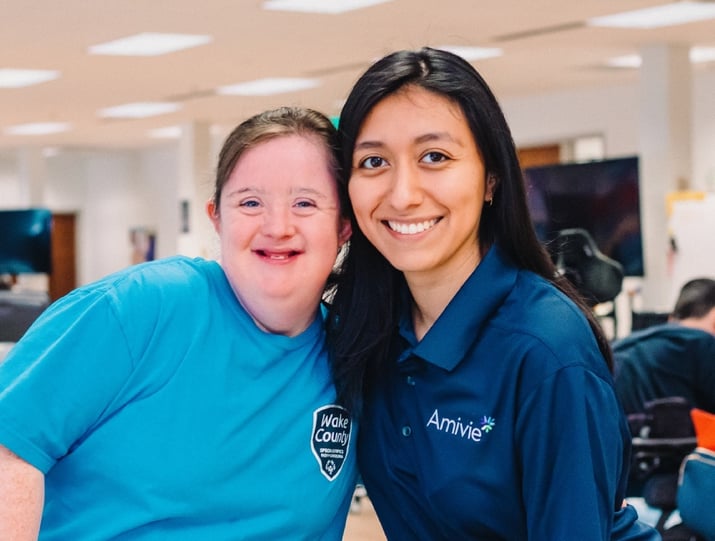 Amivie team member smiling with client